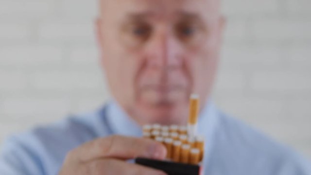 Image with a Businessperson Offers to Another Smoker a Cigarette from a New Pack