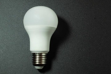 LED lamp on a dark background, designed to illuminate the home, street and other rooms