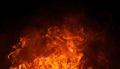 Obraz premium Texture of burn fire with particles embers. Flames on isolated black background. Texture for banner,flyer,card