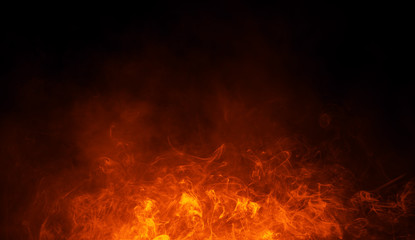 Texture of burn fire with particles embers. Flames on isolated black background. Texture for banner,flyer,card