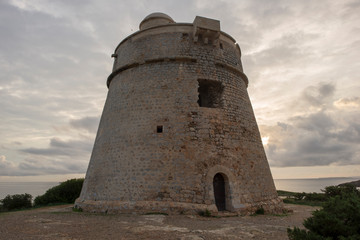 Fototapeta na wymiar Sunrise at the tower of Sa Sal Rossa, Ibiza