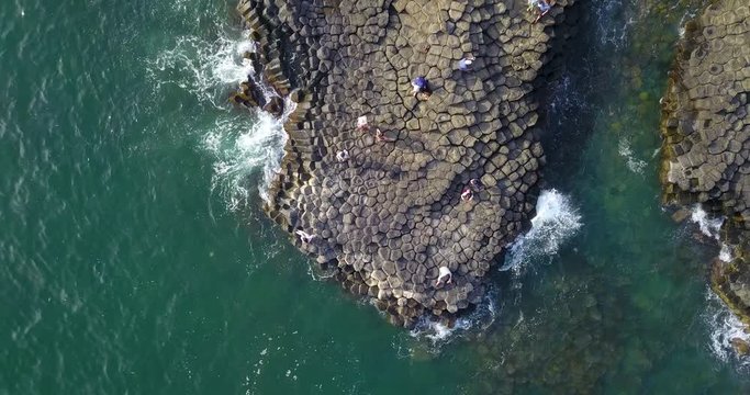 Vietnam natural landscape. Stock footage Ganh Da Dia reef in Phu Yen, Vietnam with special stones, rock make great terrain. Aerial view, top view of Ganh Da Dia sea with amazing basalt causeway shape