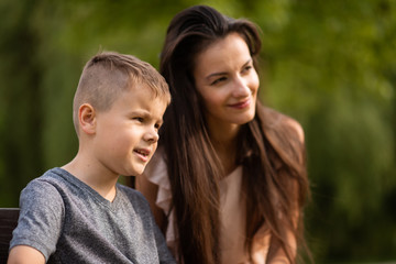 Obraz premium Candid shot of mother and son outdoors