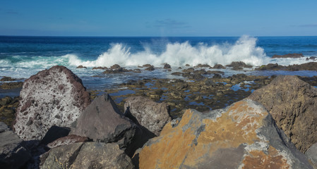Waves hitting the rocky coast