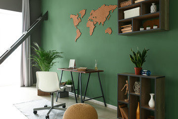 Stylish interior of room with green wall