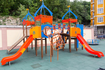 Empty playground in the yard of the house