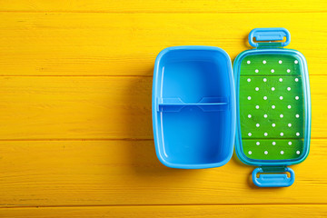Empty school lunch box on wooden background