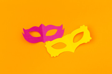 cut out colored paper figures for the holiday Mardi Gras, colour background