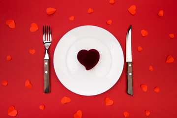 Box witha ring, table setting on a red background. Concept Valentine's Day. - Image