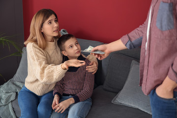 Man giving alimony to his ex-family at home