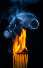 Match, smoke and flame