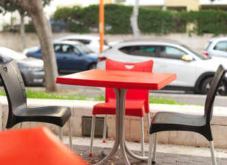 Street cafe with plastic furniture