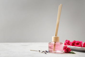 Rose reed diffuser on table