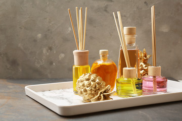 Tray with different reed diffusers on table