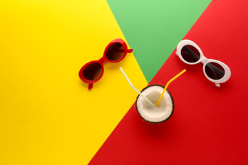 Creative composition with tropical cocktail on color background