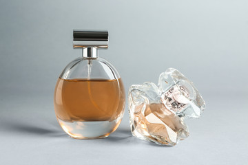 Bottles of perfume on light background