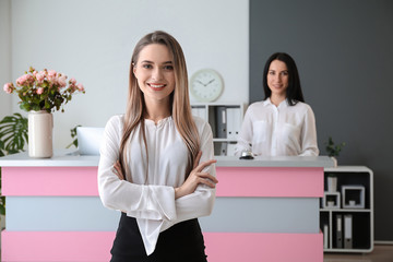 Young female receptionist in hotel