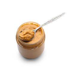 Jar with tasty peanut butter on white background