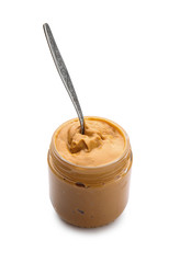 Jar with tasty peanut butter on white background