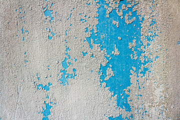 Closeup white wall texture with cracked paint