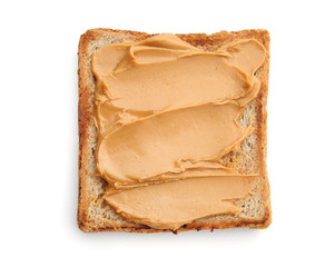 Piece of bread with tasty peanut butter on white background