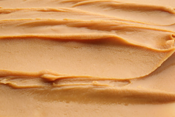 Texture of tasty peanut butter, closeup