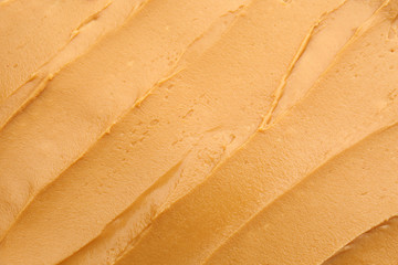 Texture of tasty peanut butter, closeup