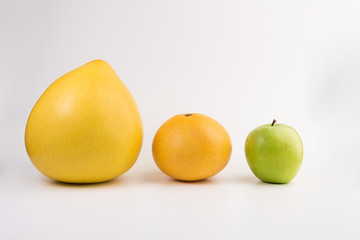pomelo, apple and grapefruit isolated  on white background