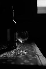 Wine Glass and bottle  in the dark