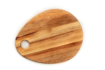 A photo of a wooden cutting board, shot from the top on a white background with a place for text. A cooking frame with copy space