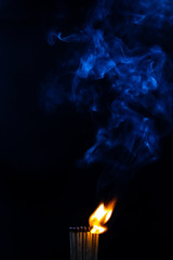 Match, smoke and flame