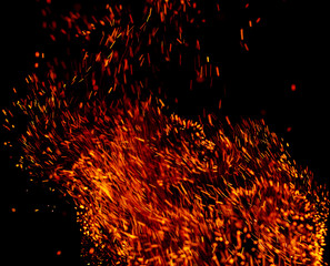 flame of fire with sparks on a black background