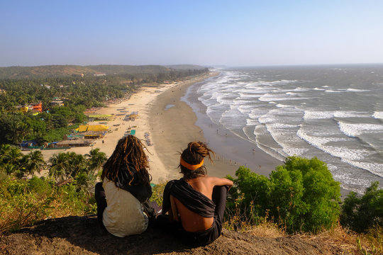 Two rasta sitting on a mountain above Arambol beach in Goa
