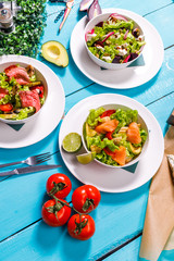 salad on a wooden blue table.