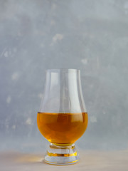 Irish Whiskey Glass Textured Paper Background Portrait Close Up