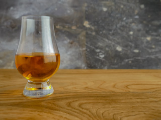 Irish Whiskey Glass on Wood and Slate Background Medium Shot