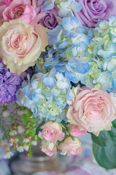 Beautiful bouquet of spring flowers in a vase on the table. Lovely bunch of flowers .