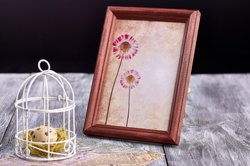 Quail's egg for Easter, on a wooden background.
