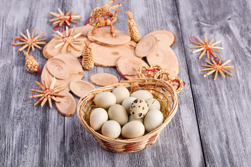 Quail's egg for Easter, on a wooden background.