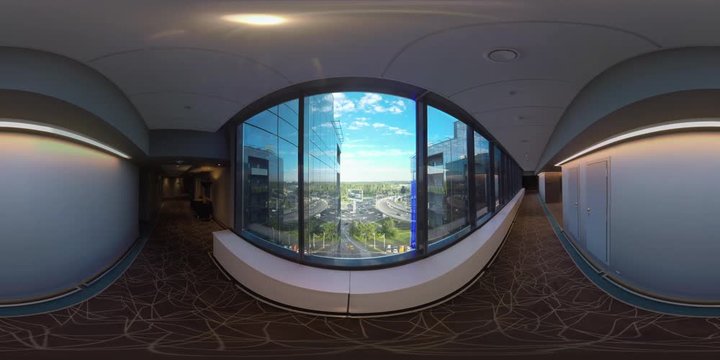 MOSCOW, RUSSIA - AUGUST 08, 2017: 360 VR video. Inner view of Radisson Blu hotel. Empty hall with window overlooking glassy facade of building and car traffic on city roads