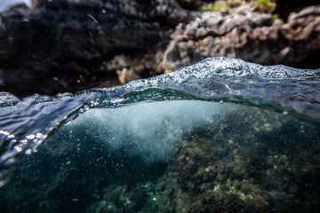 half over half underwater shot on a beautiful bay in Palma de Mallorca, Coast line water line macro...