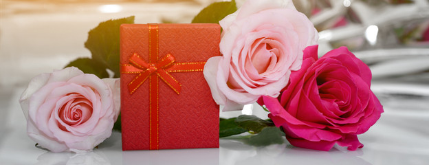 Three Roses and present box. - Valentines and 8 March Mother Women's Day concept.