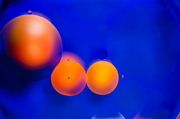 orange and yellow circles on blue water - 249497002