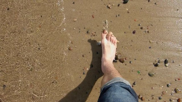 Male Feet Standing and Walking on Sandy Beach POV Slow Motion