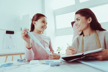 Fototapeta premium Delighted family having tailoring business