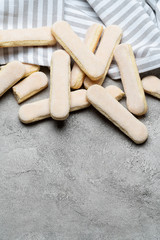 Italian Savoiardi ladyfingers Biscuits on concrete backgound with copy space