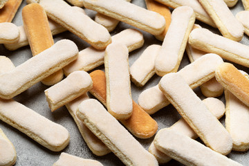 Italian Savoiardi ladyfingers Biscuits on concrete backgound