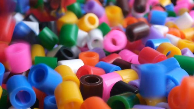 Colorful fusible plastic beads. Close up.