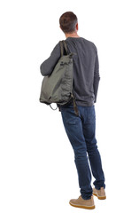 Back view of a man with a green bag.