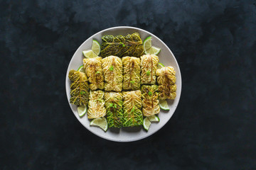 Fresh appetizing cabbage rolls tied with string.